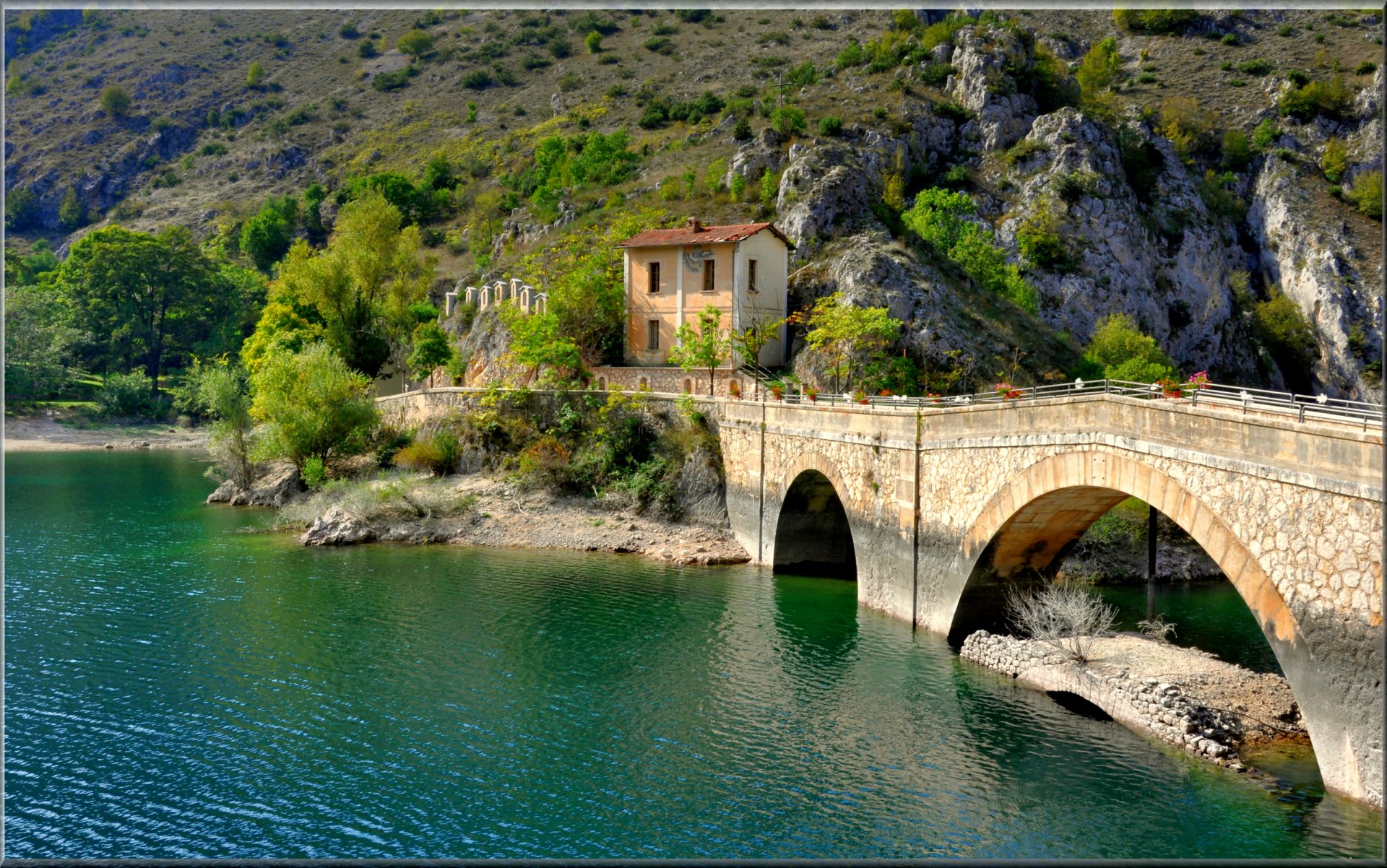 villalago italy mountain lake bridge house