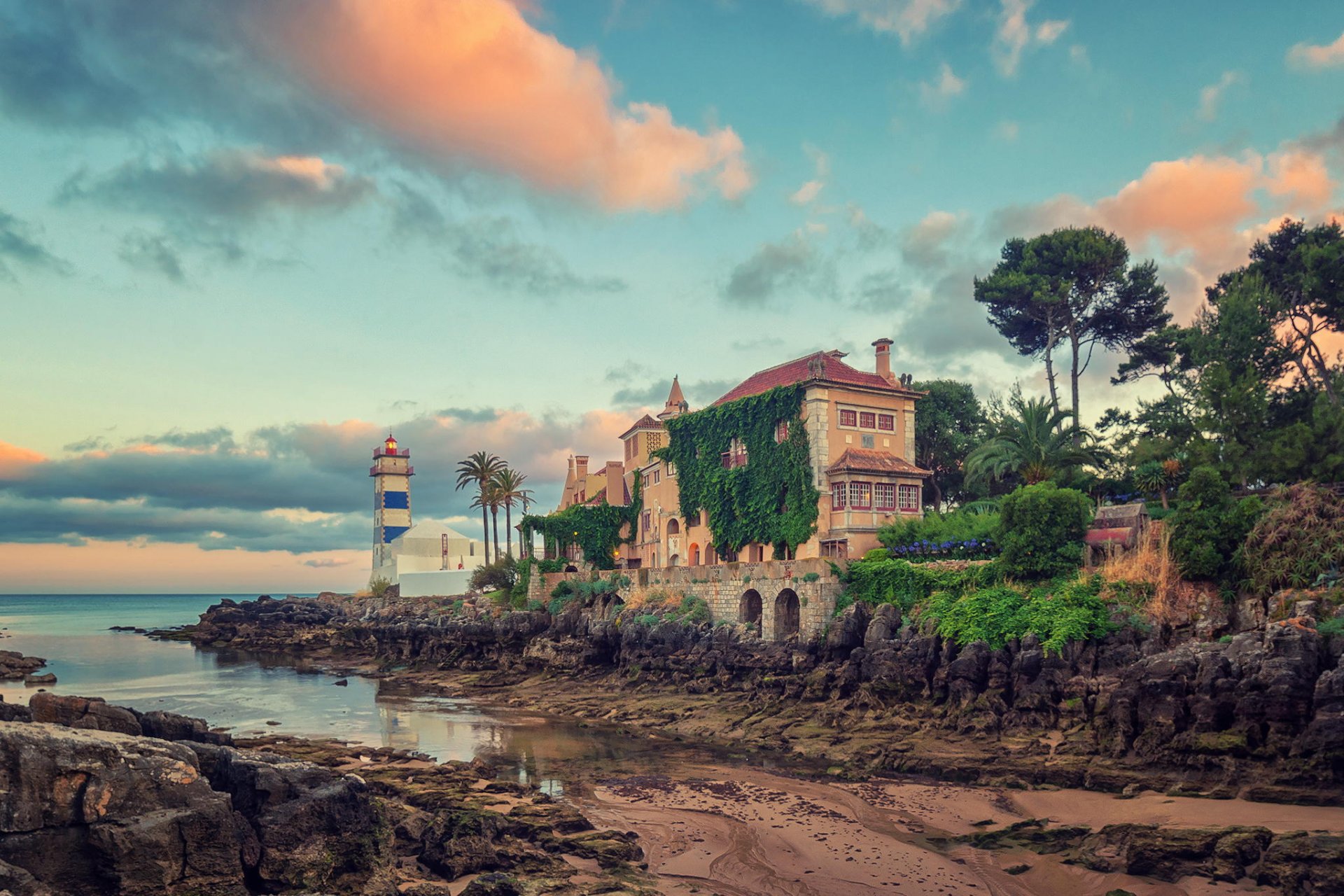 faro villa paisaje playa piedras océano