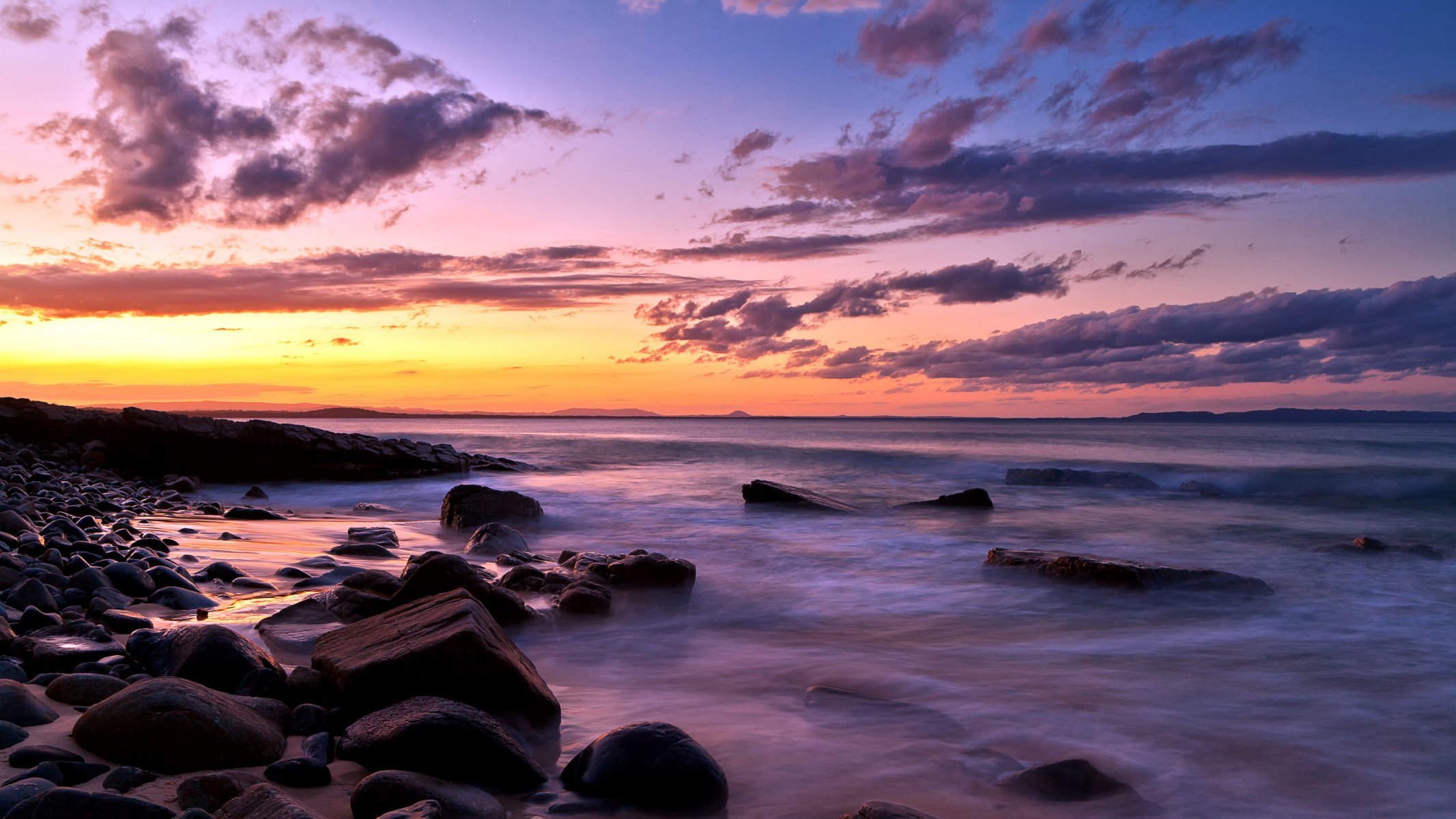 unset sea rock landscape