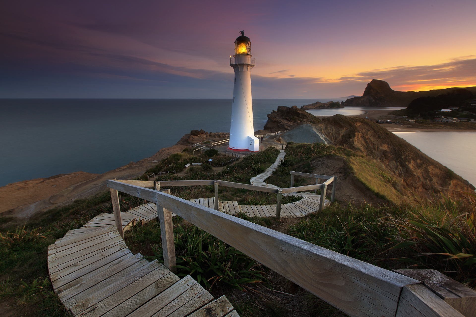 ea rock lighthouse sunset sky ocean