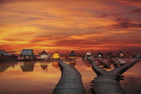 Houses on the sea with bridges on the background of beautiful clouds