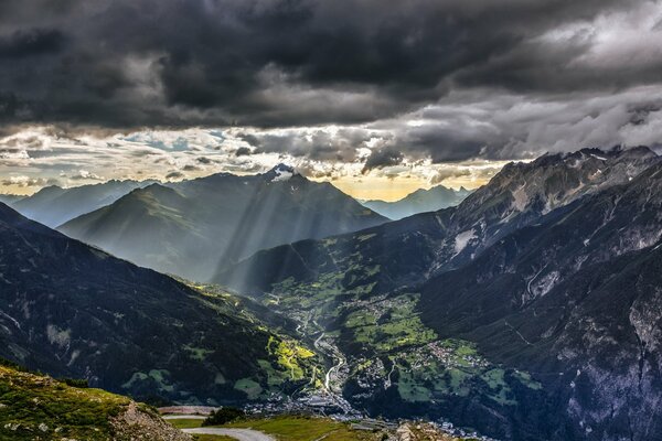 Mountain landscape with rays from clouds