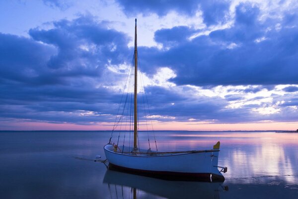 Evening sunset. Boat at sea