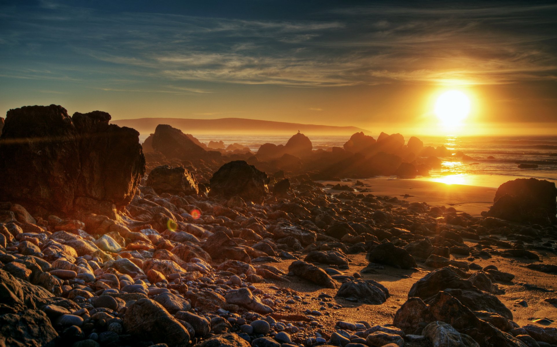 dawn sunset sun nature sea stones beach photo