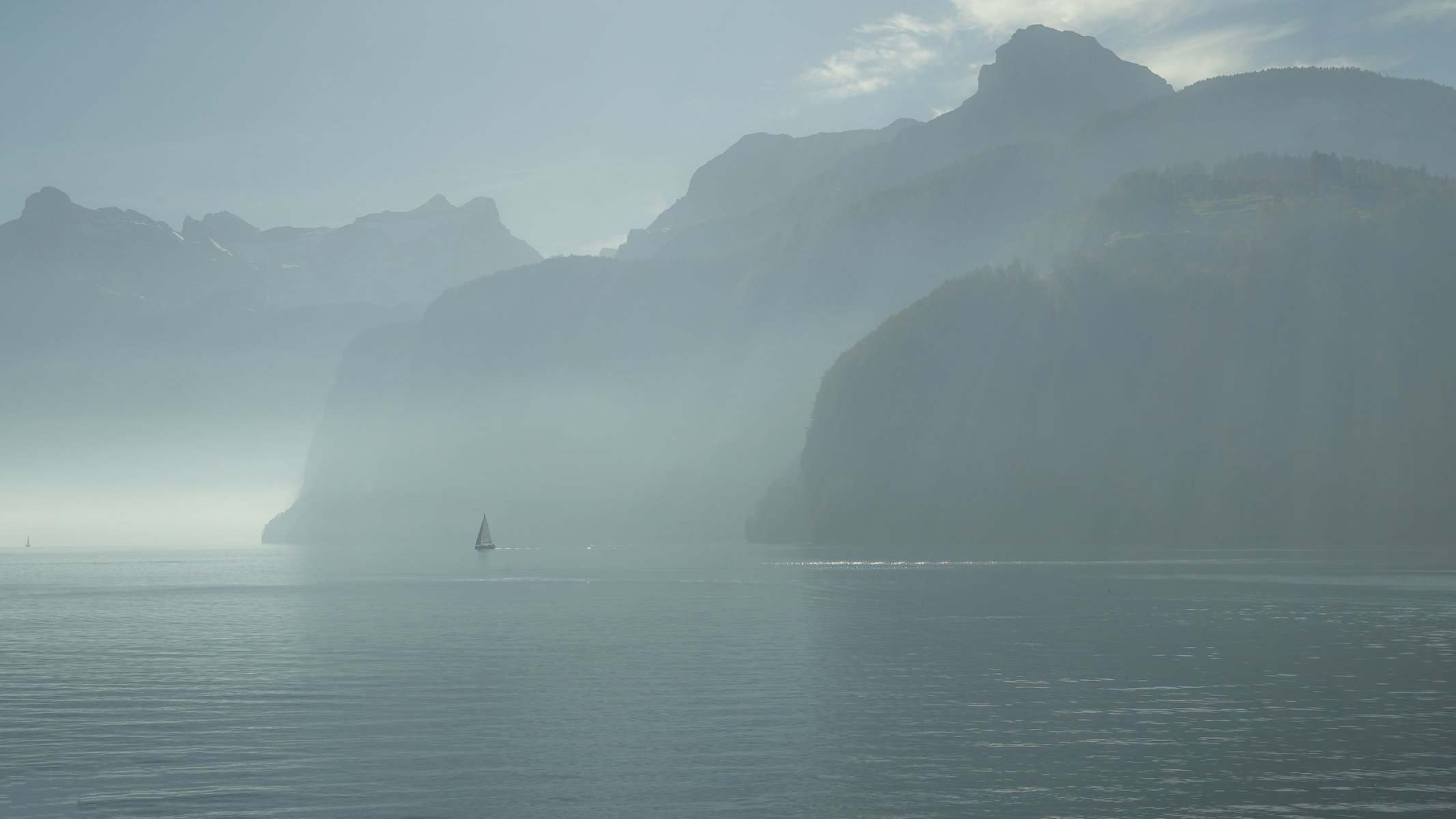 bauen canton of uri switzerland lake lucerne sailboats morning fog