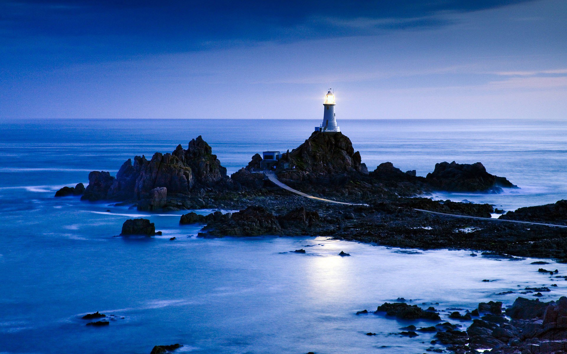 architecture beaches clouds coast lamps landscapes light lighthouse moonlight nature evening ocean reflection road rock sea landscape shore sidewalk sky stone street water wave