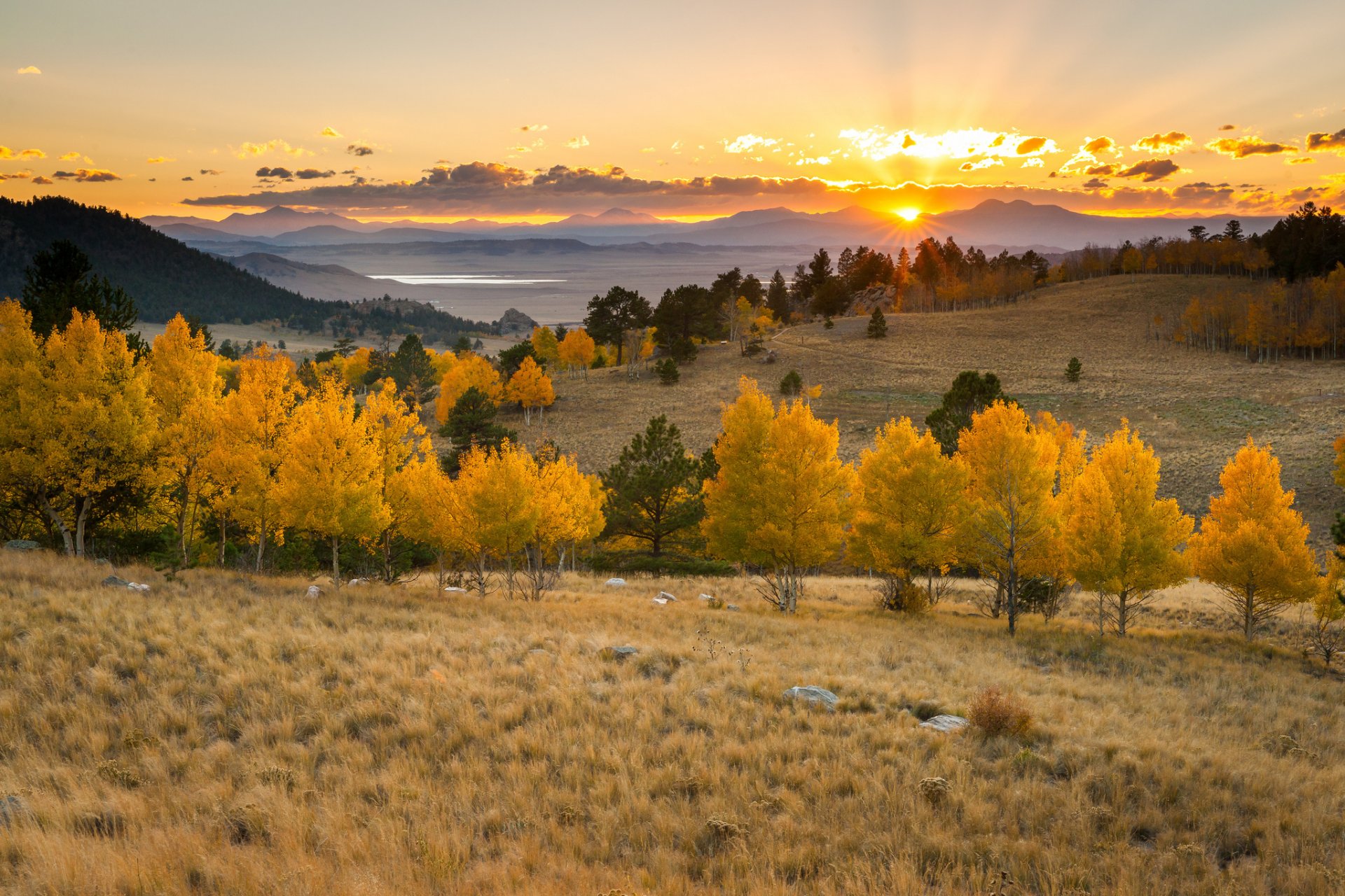 unset mountain tree lake sun clouds horizon orange sky