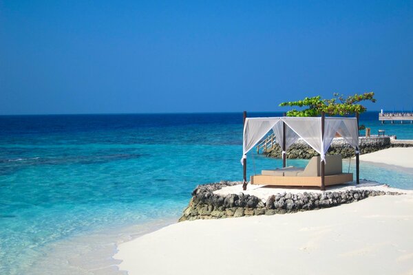 Equipped beach on white sand by the ocean