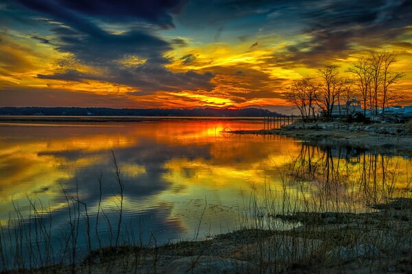 Sunset glow over the lake and trees