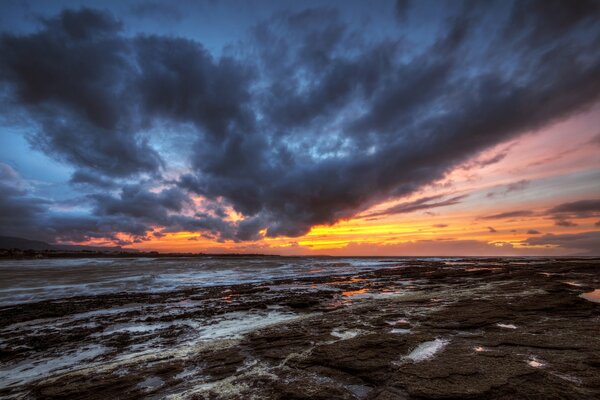 Menacing sky over the beach during sunset