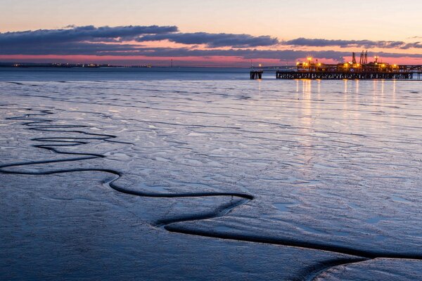 Winter city on the background of sunset