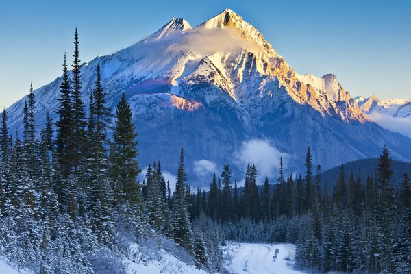 Snowy mountains on the background of sunset