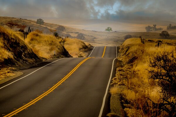 The road that goes into the distance. Impending storm