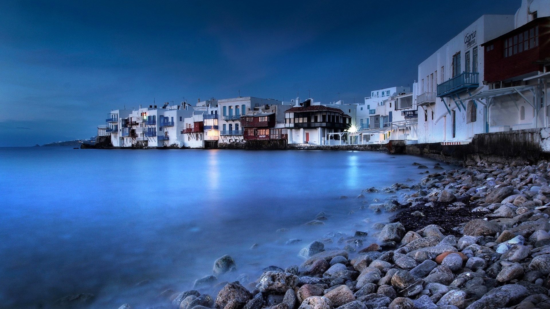 mykonos grecja wyspa noc niebo morze miasto domy