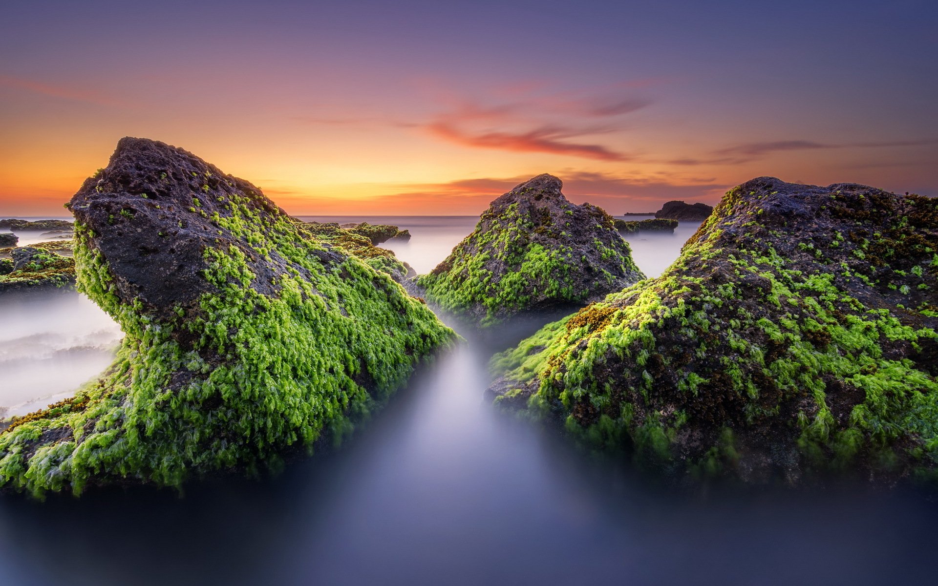 unset sea stones landscape