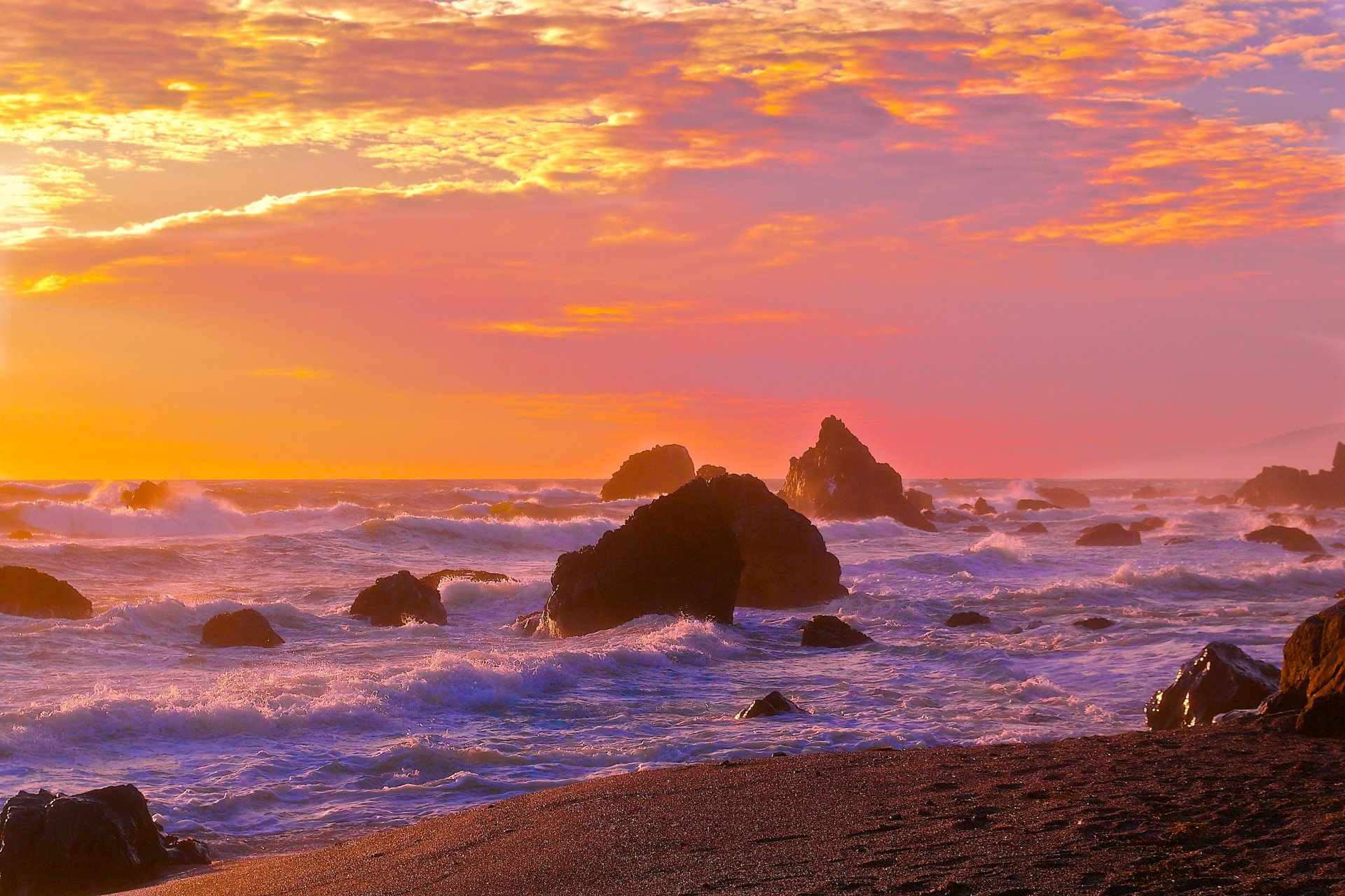 ea waves beach rock sky sunset horizon