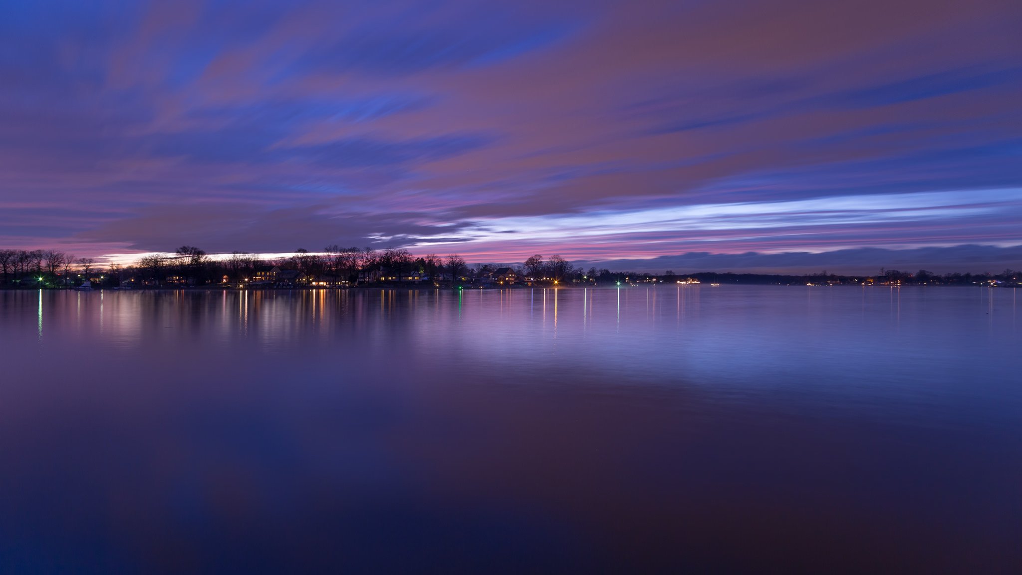 stati uniti maryland baltimora fiume contea sera crepuscolo luci riva alberi viola cielo tramonto nuvole