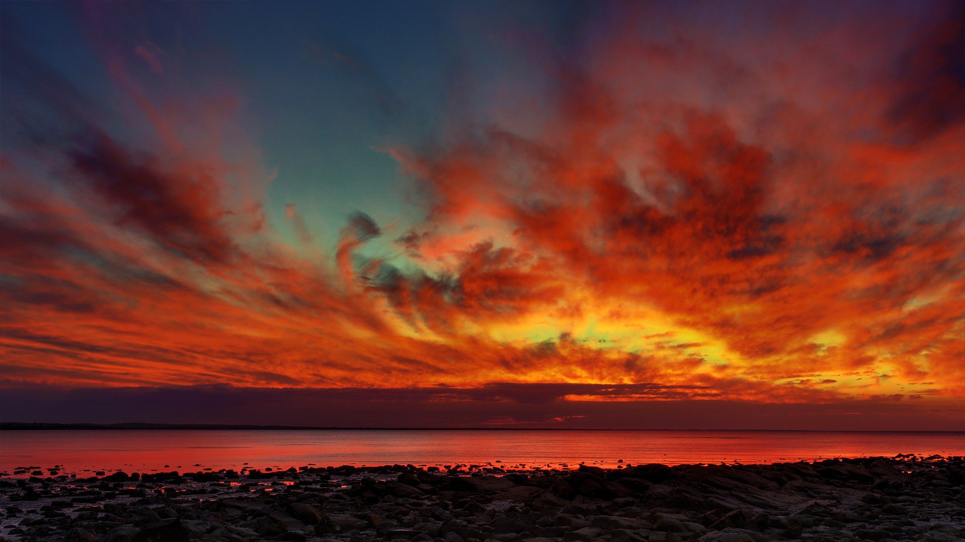 cielo nubes puesta de sol resplandor mar costa piedras