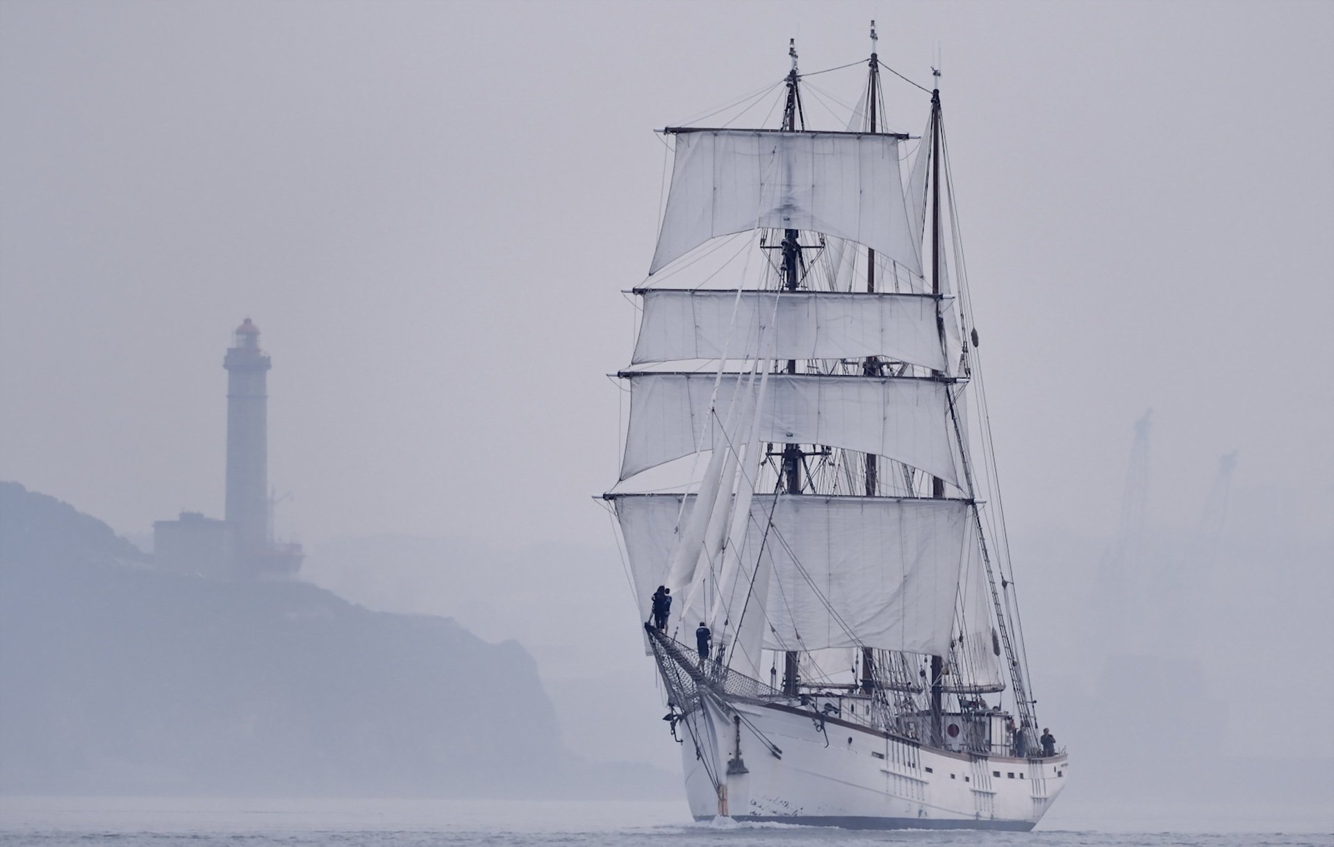 ailboats lighthouse fog sea landscape