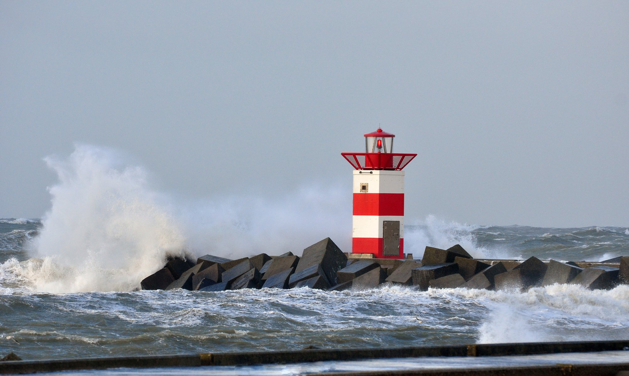 north sea storm spit lighthouse scheveningen the netherland