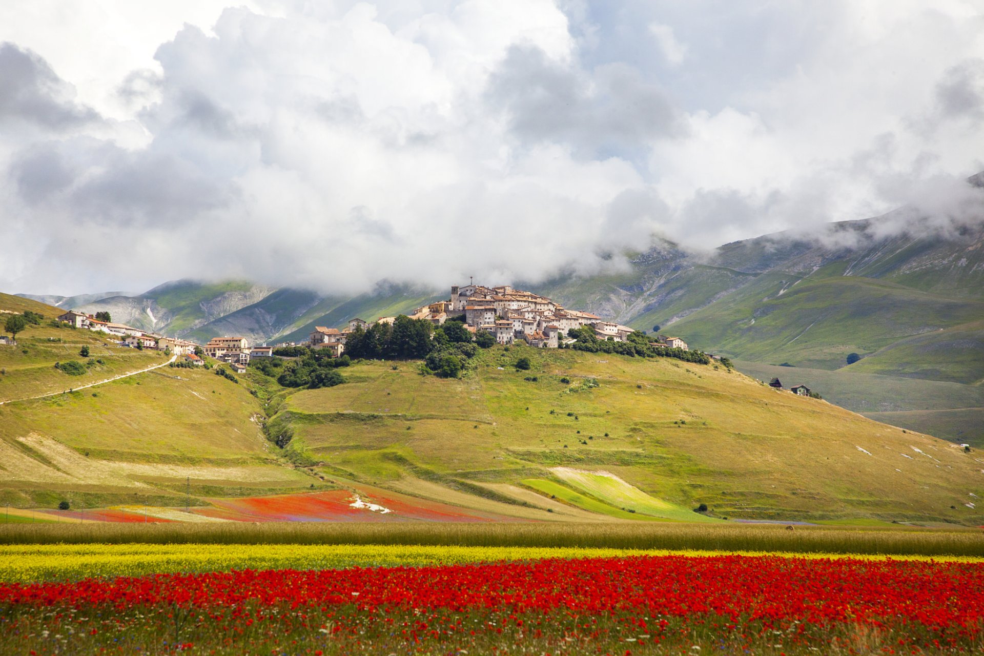 italy sky clouds hills the field flower town house