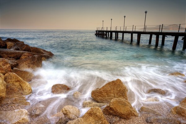 A long wooden pier in the Distance