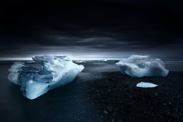 An ice floe on the seashore at dusk