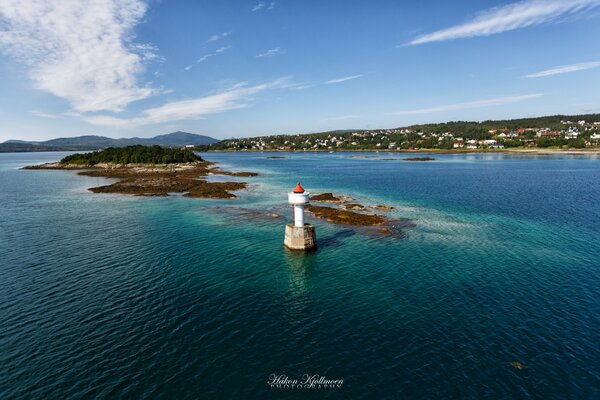 Lighthouse in the middle of the turquoise sea