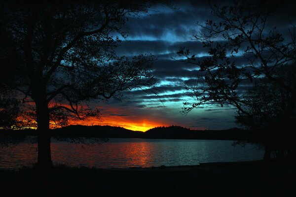 Sunset on the lake like a fiery flame