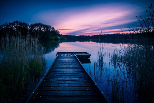 Purple sunset on a wooden whitefish