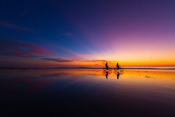 Cyclists meet a gorgeous sunset