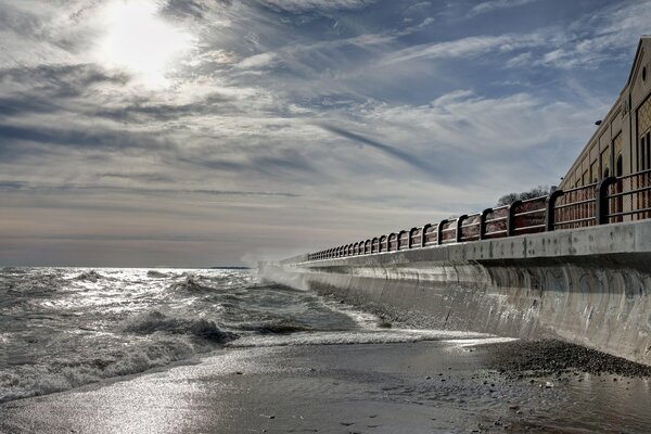 Sea waves beating against the pier