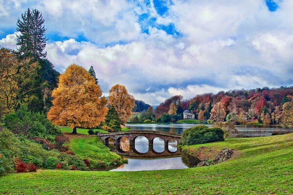 A bridge on the background of an autumn English landscape