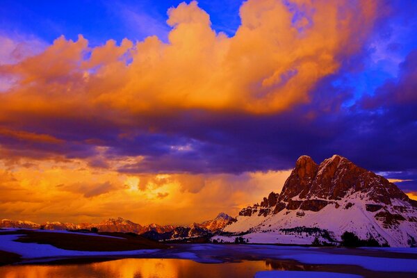 Mountains on the background of a juicy orange sunset