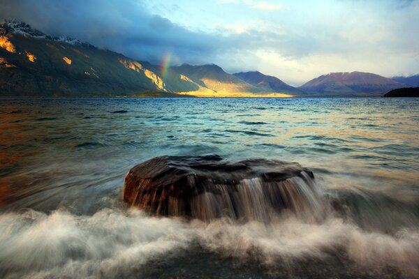 Lake and mountains. Landscape with waves