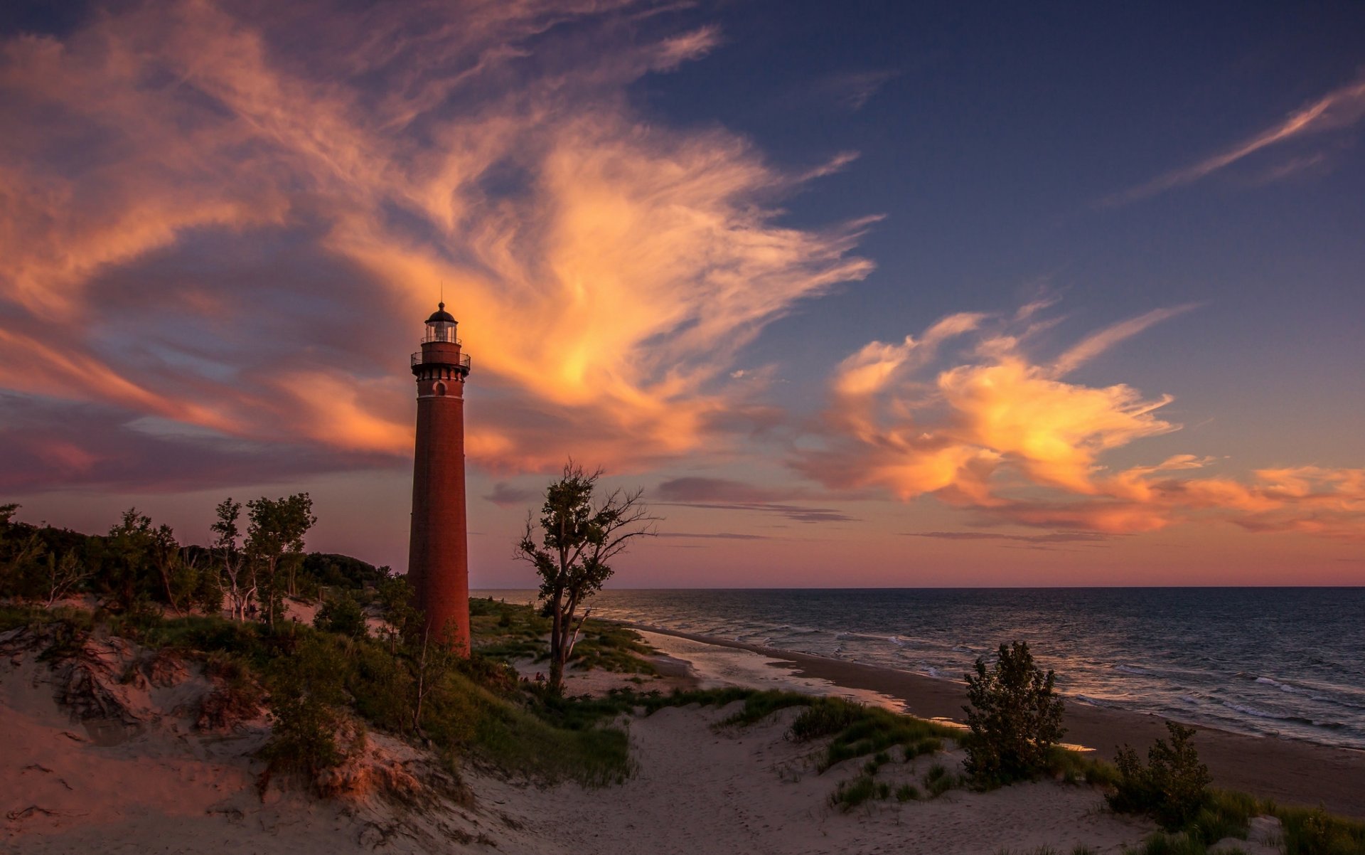 lago michigan faro playa arena puesta de sol nubes