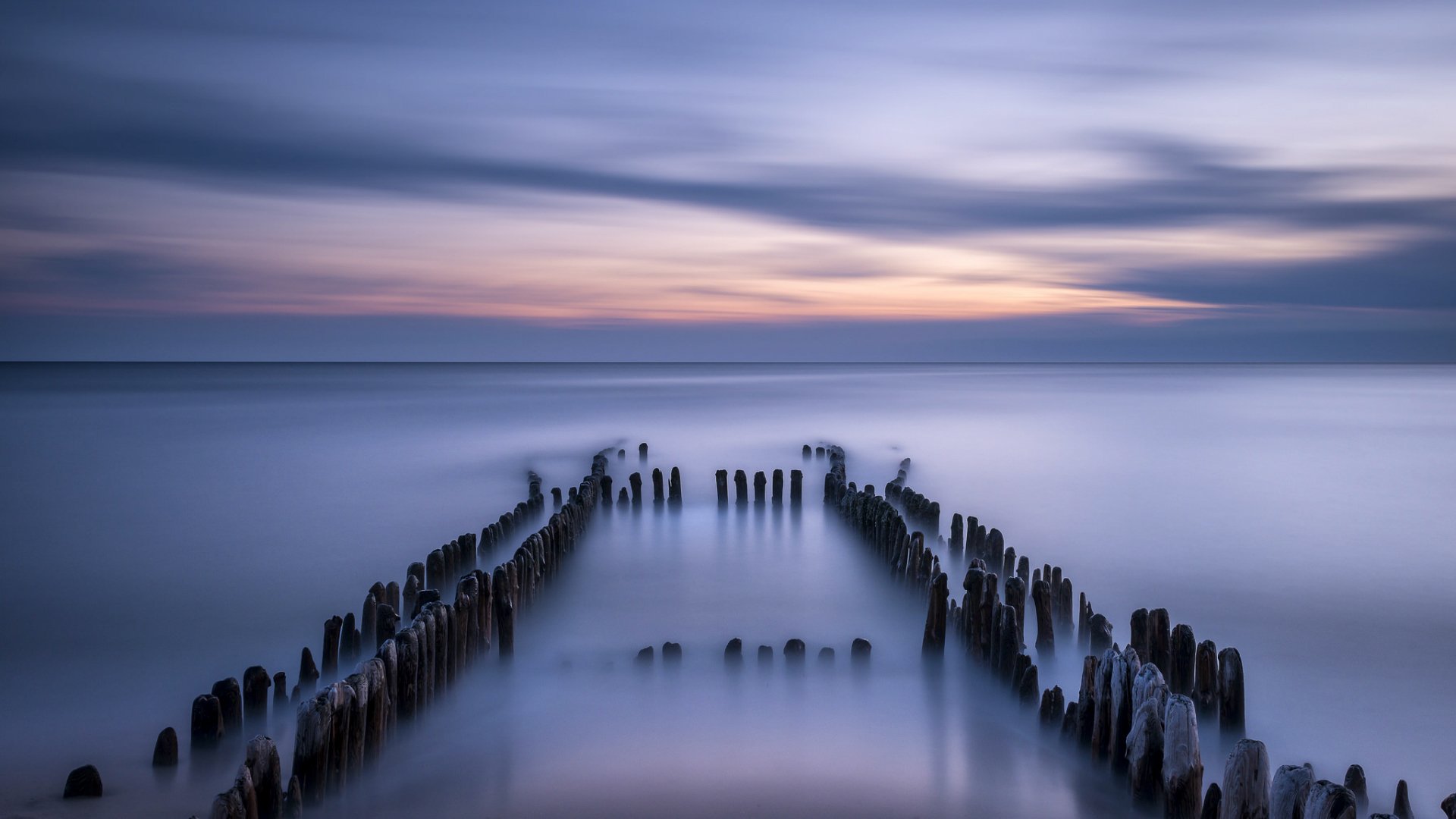 germania mare del nord calma riva pilastri sera tramonto cielo orizzonte