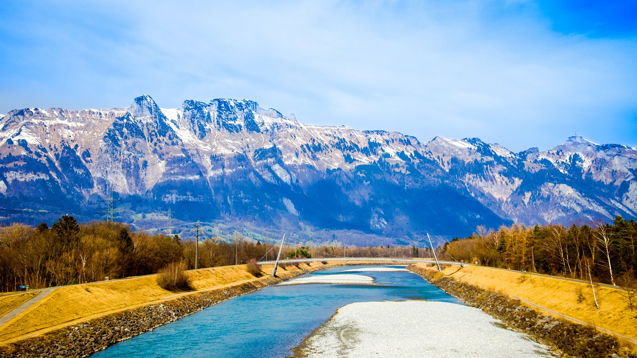 suisse alpes ciel nuages montagnes neige rivière pont