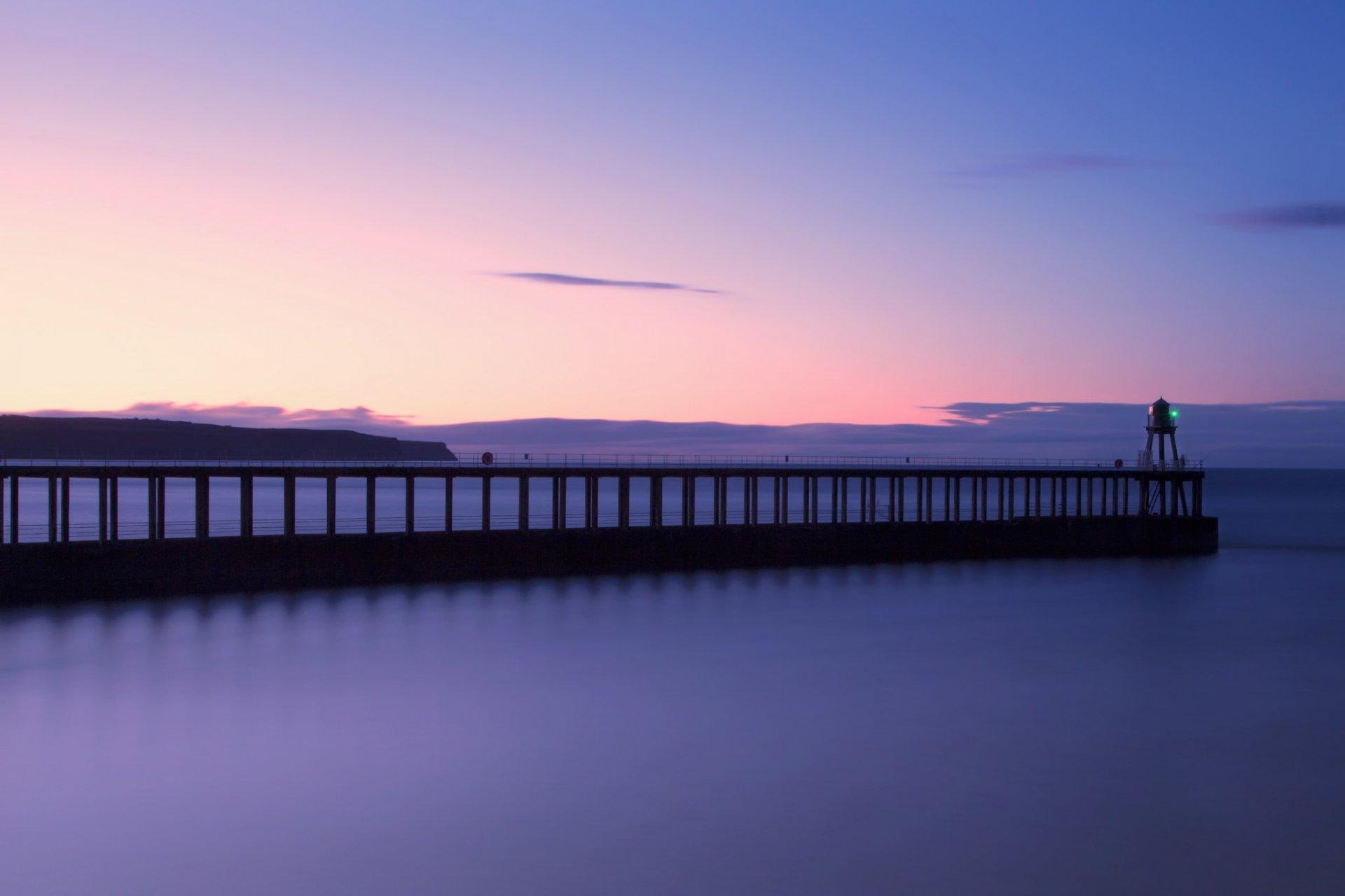 united kingdom england north yorkshire north sea beach pier lighthouse night sunset sky cloud