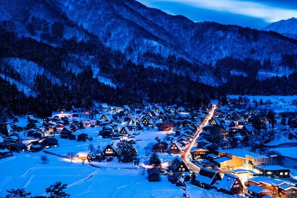 Evening lights of a village in the mountains