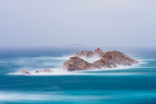 Lighthouses glow in the sea