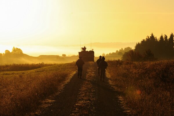 Soldiers following in a beautiful sunset