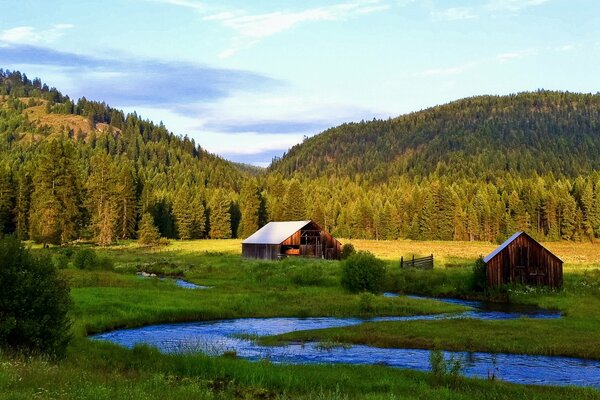 Wooden houses surrounded by hills