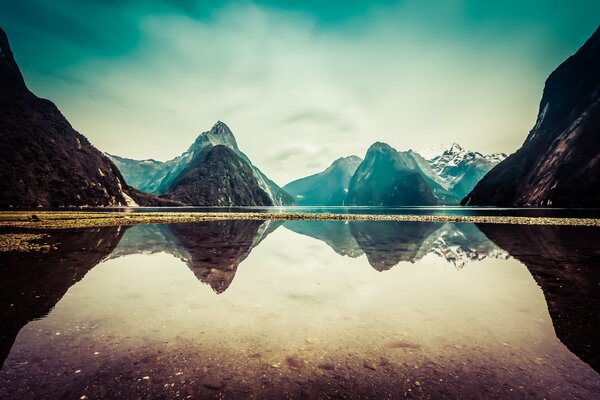 Reflection of snowy mountains in the lake