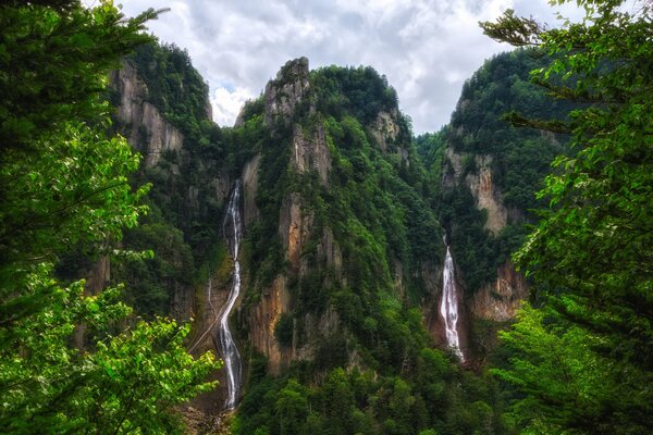 Waterfall landscape in Japan against the background of trees