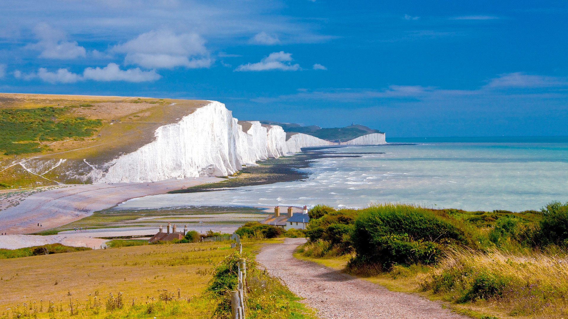 cielo nubes acantilado rocas árboles camino mar inglaterra casas