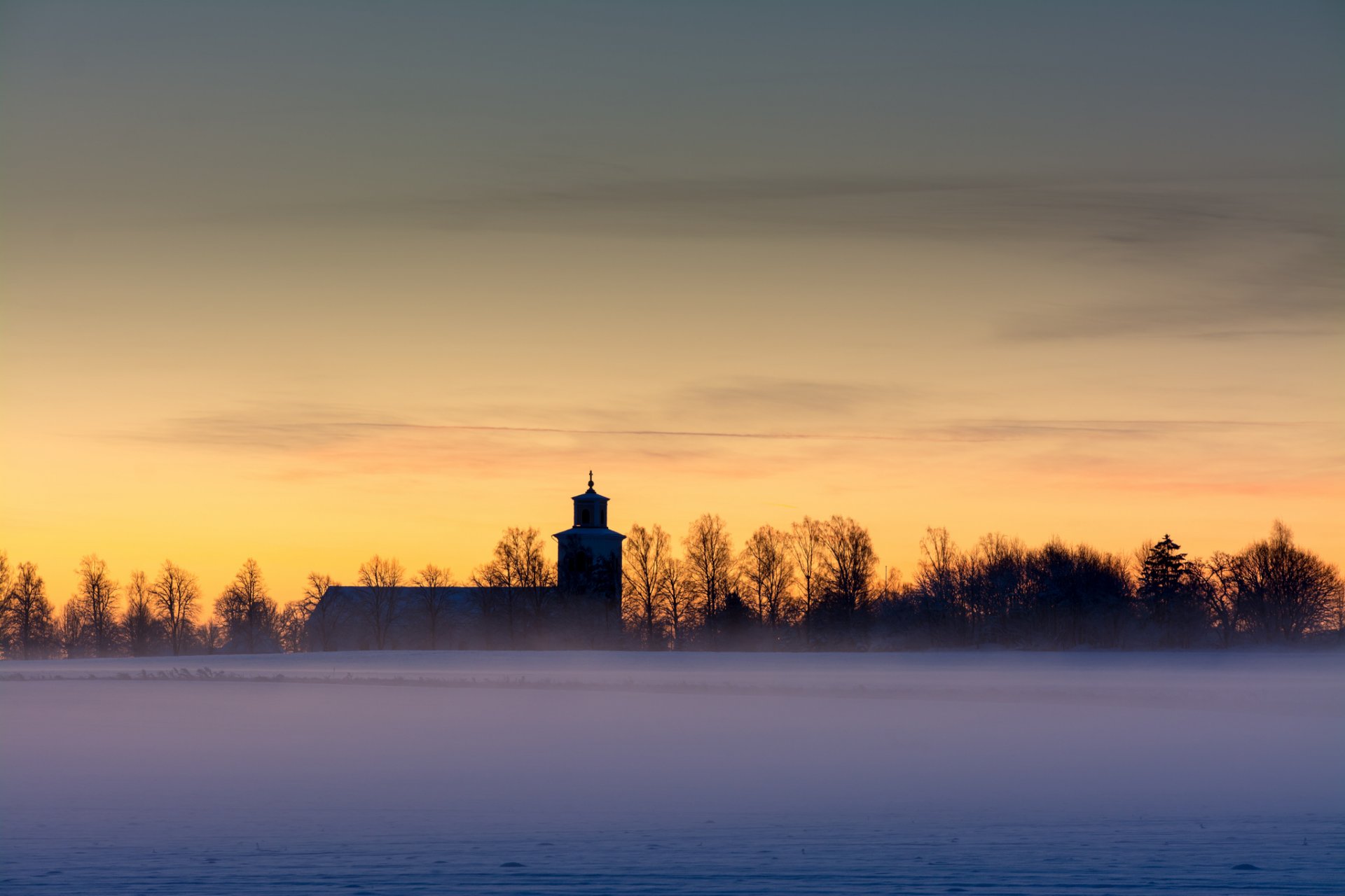 weden morning dawn yellow sky clouds the field church tree fog winter snow