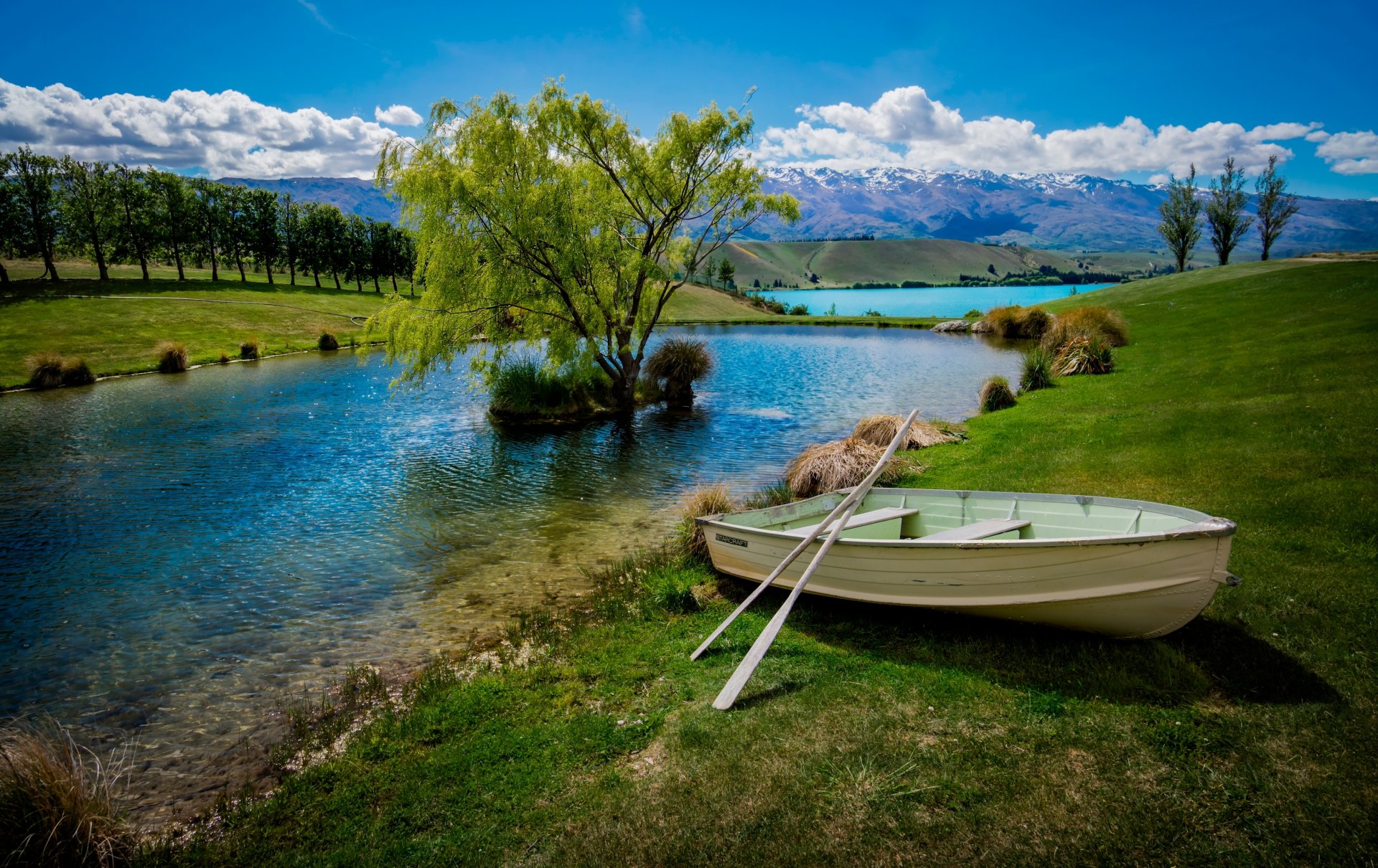 lake boat tree mountain