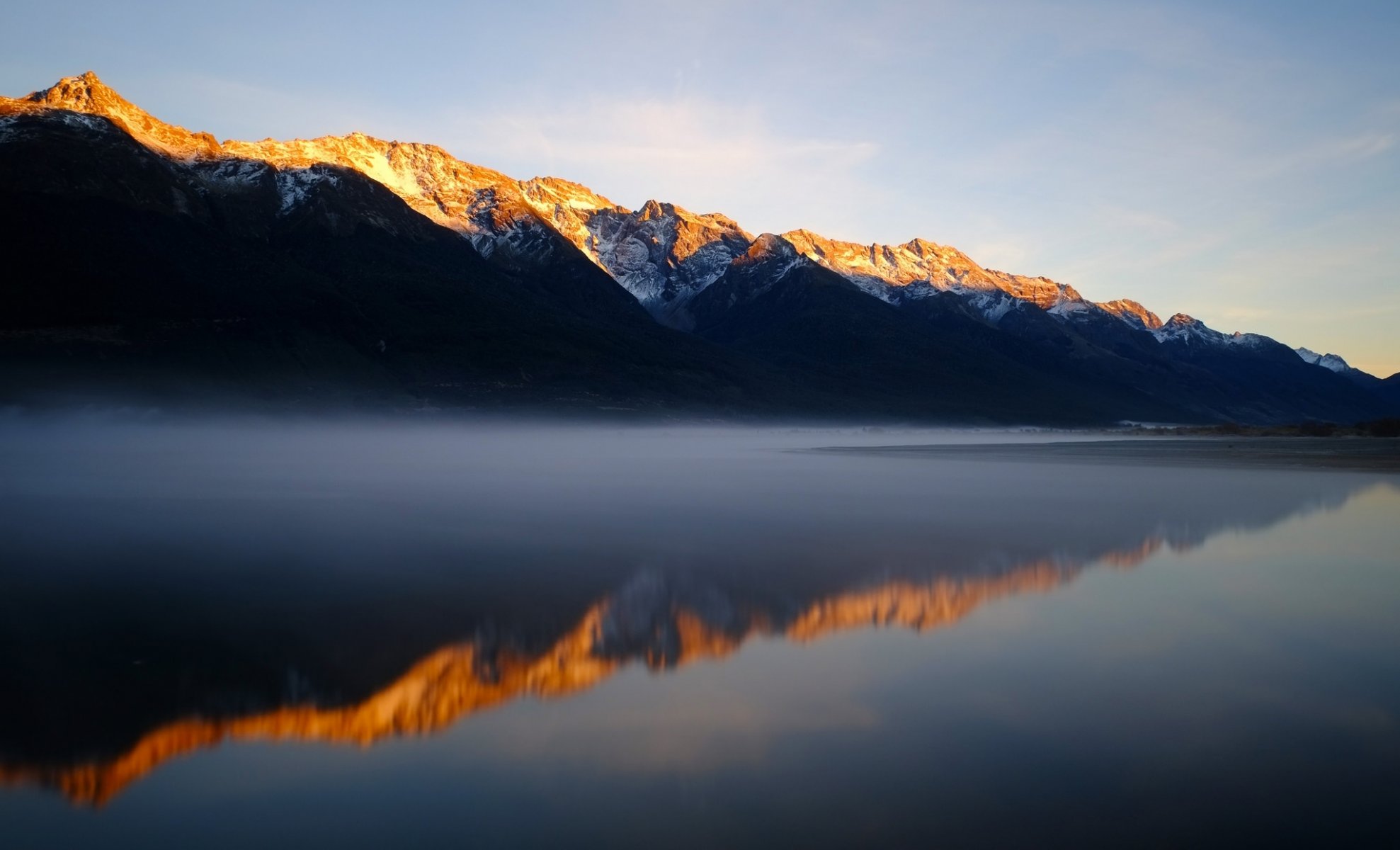 mountain lake morning fog reflection