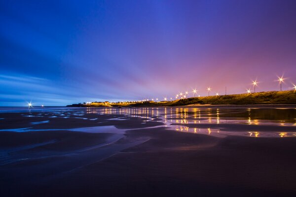 Low tide and the North Sea coast. Great Britain. Purple sky